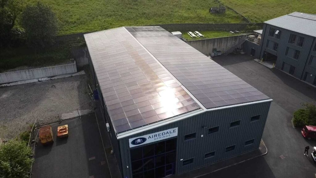 DNO Application for Solar: What UK Businesses Need to Know a building with solar panels on the roof - DNO application for solar